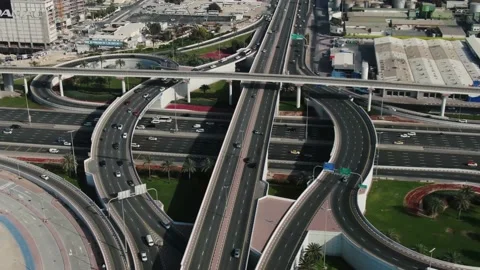 Drone footage of a busy intersection on a highway in Dubai, lots of traffic, 4k Stockbeeldmateriaal 151931745