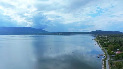 Drone footage captured in September over Lago di Varano in Apulia shows calm Stock Footage 336539176