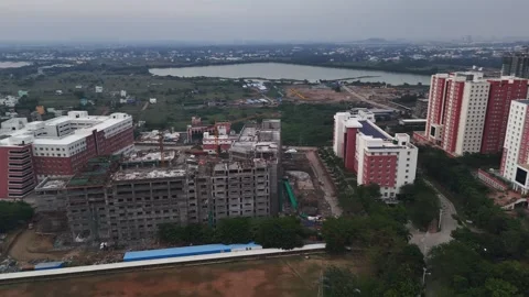 Drone footage captures a developing city with new high-rise apartments and 스톡 동영상 317302616