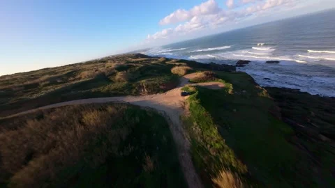 Drone footage captures dramatic coastline at golden hour Stock Footage 344579607
