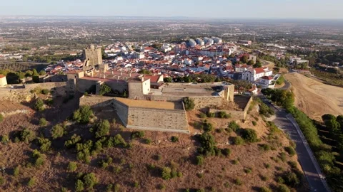 Drone footage captures old town with castle ruins and terracotta rooftops Video stock 346061518