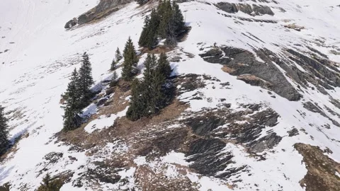 Drone footage captures a rugged mountain ridge in the French Alps during late Stock Footage 346691569