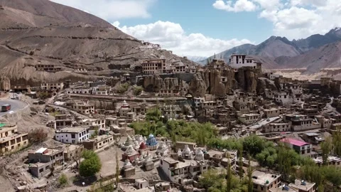 Drone footage capturing the ancient Lamayuru Monastery surrounded by dramatic Stock Footage 310661338