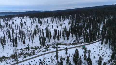 Drone footage capturing the beauty of open roads in snow valleys. Stock Footage 311794323
