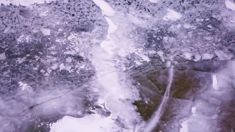 Drone footage capturing detailed ice structures floating on the surface of the Stock Footage 337722349