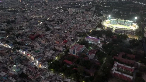 Drone footage capturing the entire Chennai cityscape at dusk, with vibrant Stock Footage 332454870