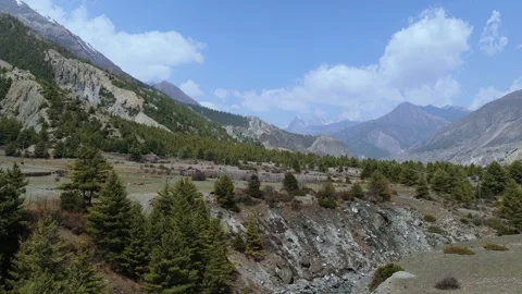 Drone footage capturing the harmony of river, valley, and mountain landscapes in Stock Footage 311018794