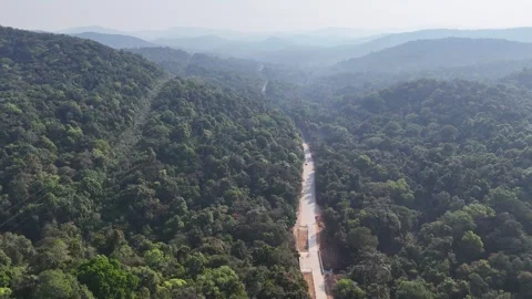 Drone footage capturing the lush ghat landscapes of Sirsi with layered green Stock Footage 336202091