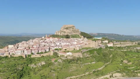Drone footage capturing the medieval hilltop town of Morella in Spain, featuring Stock Footage 346713350