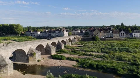 Drone footage capturing a panoramic view of the historic stone bridge spanning Stock Footage 346674592