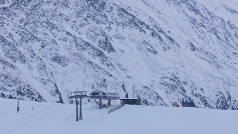Drone footage capturing a parallax effect as the Krimml ski lift moves in the Video stock 331201549