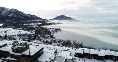 Drone footage capturing the rare spectacle of a frozen Dal Lake in Srinagar Stock Footage 310656400