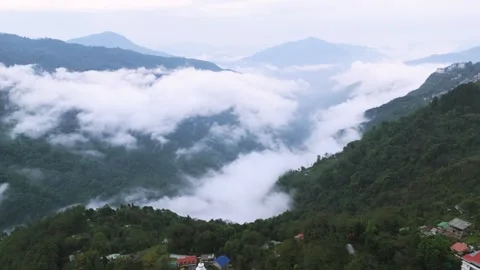Drone footage capturing the stupa amidst floating Himalayan clouds. Stock Footage 311370681