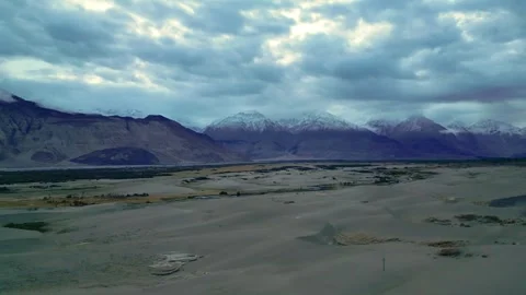 Drone footage capturing the surreal contrast of soft clouds floating above Stock Footage 310806993