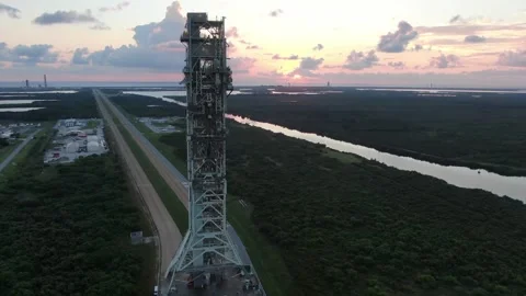 Drone footage capturing the transportation of NASA's Artemis II mobile launcher Stock Footage 288969533