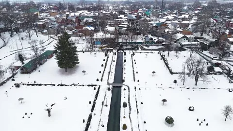 Drone footage capturing the winter magic of Verinag village with snow-laden Stock Footage 311129320