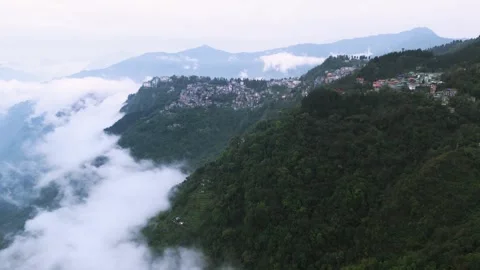 Drone footage of the cloud-kissed rooftops of Gangtok. Stock Footage 311370705