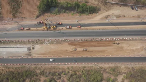 Drone footage a construction working tractor is refining the soil in prepara Stock Footage 330240784