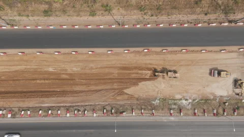Drone footage a construction working tractor is refining the soil Stock Footage 335365920