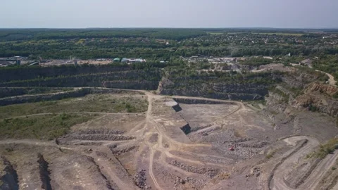 Drone footage of deep open pit granite quarry with mining industry site Stock Footage 343134303
