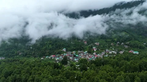 Drone footage of dense greenery in Himalayan valley wrapped in monsoon clouds. Stock Footage 310658819