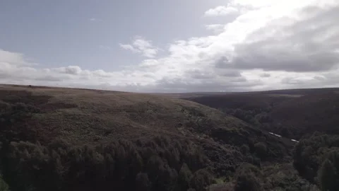 Drone footage descending fields and hills, D-LOG, 24fps, 5k Stock Footage 277227939