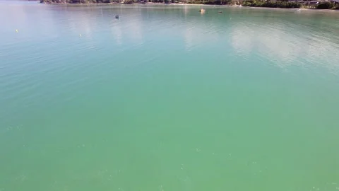 Drone footage of docking boats on clam ocean Stock Footage 320669869