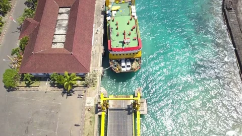 Drone Footage of docking ferry. Ferry transports cars, motorcycles, people 動画素材 220845385