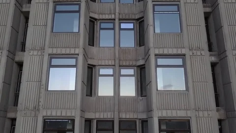 Drone footage elevating by residential building windows Stock Footage 93838196