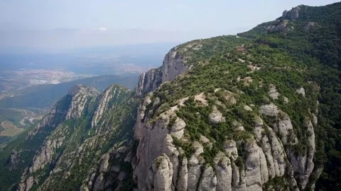 Drone footage of an epic mountain settlement called Montserrat in the foothills Stockbeeldmateriaal 332177797