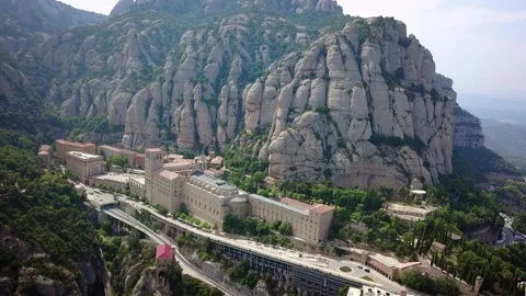 Drone footage of an epic mountain settlement called Montserrat in the foothills Stockbeeldmateriaal 332177836