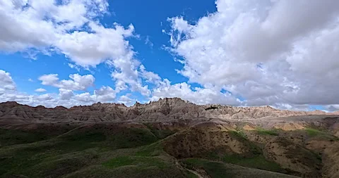 Drone footage of fast moving clouds in the Badlands of South Dakota, time lapse Stock Footage 326163672