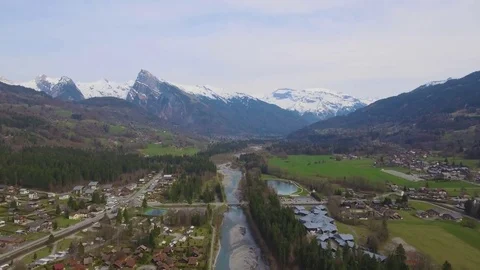 Drone footage of a fly over of an Alpine Valley and Forest in the Spring Stock Footage 74076596