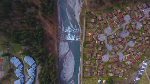 Drone footage of a fly over of an Alpine Valley and Forest in the Spring Stock Footage 74076607
