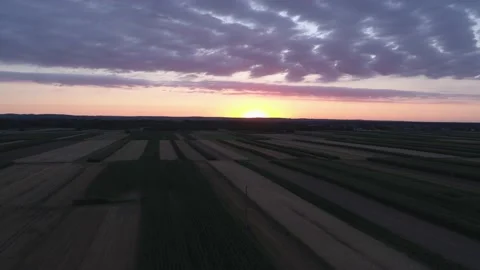 Drone footage - flying above fields with colorful evening sky Stock Footage 148433360