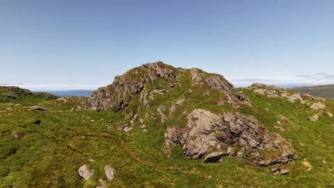 Drone footage flying around mountain rock formation in Norway Stock Footage 340079924