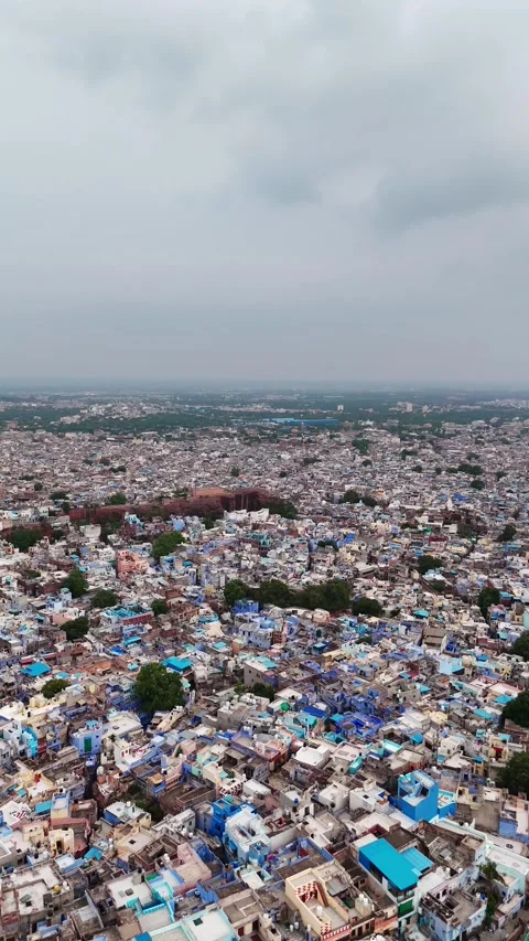Drone footage flying over the blue-painted houses of Jodhpur Stock Footage 310659917