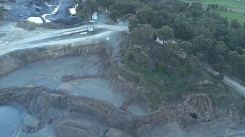 Drone footage flying over an open pit mining quarry Vidéo 342526609