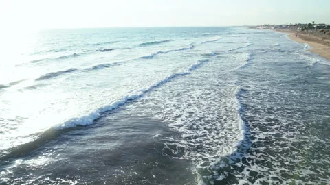 Drone footage, flying over sandy beach, calm waves, aerial footage Stock Footage 310048233