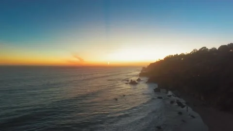 Drone footage of foaming waves at the sandy shore at El Matador Beach, Malibu Video stock 137409621
