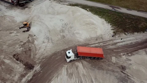 Drone Footage of a Front Loader and Lorry in a Sand Quarry Stock Footage 89402874