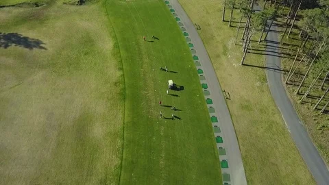 Drone Footage of Golf Course Practice Range With Golfers at Tees Stock Footage 90100749