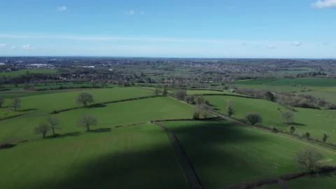 Drone footage of grassy fields and clouds 스톡 동영상 238680534