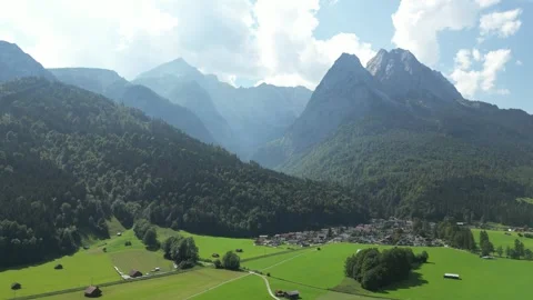 Drone Footage of Green Fields and Alpine Views Near Zugspitze Stock Footage 296923863