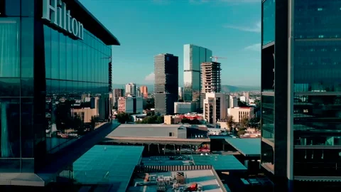 Drone footage of Hilton Hotel with a beautiful skyline Stock Footage