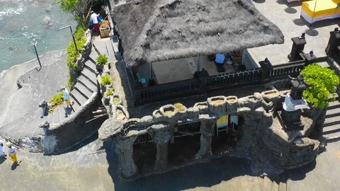 Drone footage of hindu pilgrimage temple Pura Tanah Lot Stock Footage 97508341