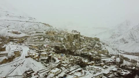Drone footage of Lamayuru Monastery blanketed in fresh snowfall, Ladakh. Stock Footage 310660933