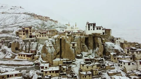 Drone footage of Lamayuru Monastery surrounded by snowy mountain silence. Stock Footage 310661209