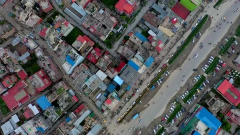 Drone Footage Looking Directly Down then Tilting Up of Downtown Kathmandu Nepal Vídeo Stock 134581538