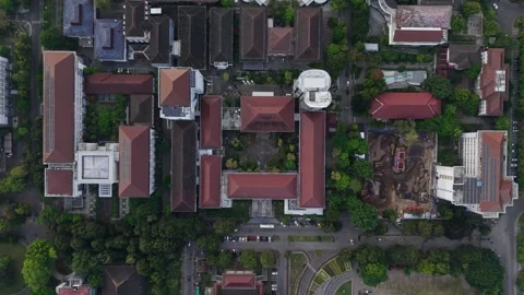 Drone footage looking down at the Faculty of Economics and Business building Stock Footage 316656888